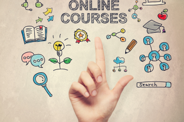 A side view of a plate of figs and berries.